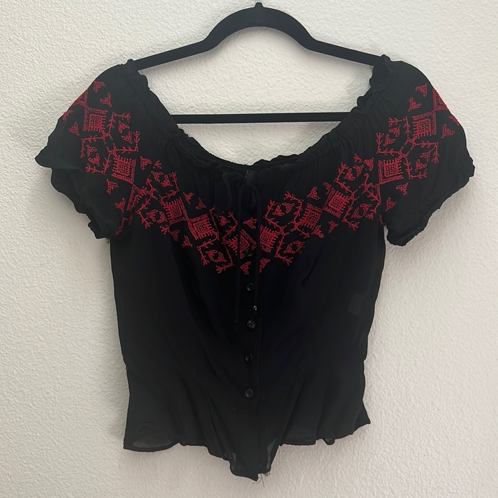 Super cute and flattering see through blouse